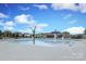 Beautiful community pool with palm tree accents, lounge chairs, and clubhouse in the background at 1914 Loggerhead Dr, Lancaster, SC 29720