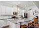Bright kitchen features white cabinets, granite countertops, stainless steel appliances, and a large island with seating at 2021 Pinyon Ln, Lancaster, SC 29720
