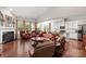 Open concept living room and kitchen area with hardwood floors and lots of natural light at 2021 Pinyon Ln, Lancaster, SC 29720