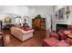 Cozy living room featuring a fireplace, hardwood floors, comfortable seating, and an open layout at 2021 Pinyon Ln, Lancaster, SC 29720