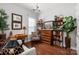 Comfortable living room features a bookshelf, desk, and natural lighting at 2021 Pinyon Ln, Lancaster, SC 29720