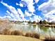 Scenic pond view with a water fountain feature and lush surroundings at 2021 Pinyon Ln, Lancaster, SC 29720