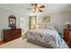 Comfortable bedroom boasts hardwood floors, plenty of natural light, and ensuite bathroom at 2025 Sagamore Rd, Charlotte, NC 28209