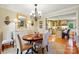 Formal dining room offering stylish chandelier, hardwood floors, and access to the kitchen at 2025 Sagamore Rd, Charlotte, NC 28209
