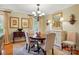 Elegant dining room with hardwood floors, classic chandelier, and ample natural light at 2025 Sagamore Rd, Charlotte, NC 28209