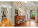Entryway featuring wood floors, staircase, and stylish wooden console table at 2025 Sagamore Rd, Charlotte, NC 28209