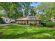 Charming brick home with manicured lawn and landscaping, creating a welcoming curb appeal at 2025 Sagamore Rd, Charlotte, NC 28209