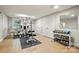 Home gym with weightlifting equipment, weights, mirrors, and rubber mats at 2025 Sagamore Rd, Charlotte, NC 28209