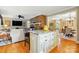 Eat-in kitchen island with granite countertop, seating, and natural light at 2025 Sagamore Rd, Charlotte, NC 28209