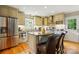 Spacious kitchen featuring stainless steel appliances, granite countertops, and a center island at 2025 Sagamore Rd, Charlotte, NC 28209