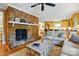 Open-concept living room with brick fireplace and seamless transition to the kitchen at 2025 Sagamore Rd, Charlotte, NC 28209