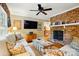 Inviting living room with brick fireplace and large TV for cozy entertaining at 2025 Sagamore Rd, Charlotte, NC 28209