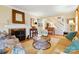 Cozy living room features a fireplace, comfortable seating, and a staircase at 2025 Sagamore Rd, Charlotte, NC 28209