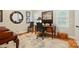 Bright office offering a desk with computer, hardwood flooring, and multiple windows at 2025 Sagamore Rd, Charlotte, NC 28209