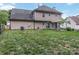 Expansive backyard featuring a covered patio, lush lawn, and a classic fence, perfect for outdoor activities and relaxation at 204 Pebble Creek Xing, Fort Mill, SC 29715
