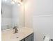 Cozy bathroom with single sink, mirror, and wainscoting at 204 Pebble Creek Xing, Fort Mill, SC 29715