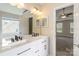 Spacious bathroom features a dual sink vanity with modern fixtures and access to the bedroom at 204 Pebble Creek Xing, Fort Mill, SC 29715
