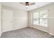 This bedroom features neutral walls, carpet, and a window at 204 Pebble Creek Xing, Fort Mill, SC 29715