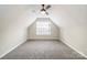 This bedroom has neutral walls, carpet, and a dormer window at 204 Pebble Creek Xing, Fort Mill, SC 29715