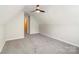 This bedroom has neutral walls, carpet, and a dormer window at 204 Pebble Creek Xing, Fort Mill, SC 29715
