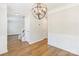 Dining room with decorative light fixture and traditional wainscoting at 204 Pebble Creek Xing, Fort Mill, SC 29715