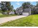 Charming two-story home with a manicured lawn and long driveway at 204 Pebble Creek Xing, Fort Mill, SC 29715