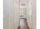 Bright hallway with hardwood floors and white doors at 204 Pebble Creek Xing, Fort Mill, SC 29715