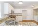 Updated kitchen with stainless steel appliances, granite countertops and adjacent laundry area at 204 Pebble Creek Xing, Fort Mill, SC 29715