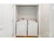 Bright laundry area features side by side washer and dryer, as well as a convenient, custom utility closet at 204 Pebble Creek Xing, Fort Mill, SC 29715