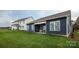 Expansive backyard featuring a covered patio, lush lawn, and a neighboring home at 2066 Skyhawk Dr, York, SC 29745