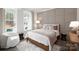Stylish bedroom featuring a cozy bed, decorative wall paneling, and comfortable seating at 2066 Skyhawk Dr, York, SC 29745