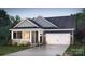 Charming single-Gathering home with a covered front porch and a two-car garage at 2066 Skyhawk Dr, York, SC 29745
