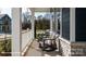 Inviting front porch with rocking chairs, stone accents and cozy curb appeal at 2066 Skyhawk Dr, York, SC 29745