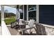 Inviting front porch with rocking chairs, stone accents and cozy curb appeal at 2066 Skyhawk Dr, York, SC 29745