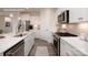 Modern kitchen with stainless steel appliances, white cabinets and island with sink at 2066 Skyhawk Dr, York, SC 29745