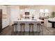 Kitchen island with seating, stainless appliances and dining area with natural light at 2066 Skyhawk Dr, York, SC 29745