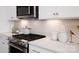 Close-up of a kitchen featuring stainless steel appliances and elegant backsplash at 2066 Skyhawk Dr, York, SC 29745