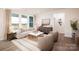 Bright living room with lots of natural light and stylish neutral furnishings at 2066 Skyhawk Dr, York, SC 29745