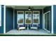 Inviting covered patio area with comfortable chairs and a view of the outdoor landscape at 2066 Skyhawk Dr, York, SC 29745