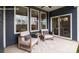 Inviting covered patio with neutral furniture, decorative rug, and a view through sliding glass doors at 2066 Skyhawk Dr, York, SC 29745