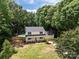 Aerial view of home with pool, fenced-in backyard, and mature trees at 219 Proctor Dr, Salisbury, NC 28147
