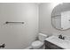 Bathroom featuring a toilet, sink, and rounded mirror at 219 Proctor Dr, Salisbury, NC 28147