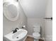 Powder room with round decorative mirror and modern fixtures at 219 Proctor Dr, Salisbury, NC 28147