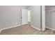 Neutral bedroom featuring closet space and neutral wood-look floors at 219 Proctor Dr, Salisbury, NC 28147