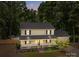 Charming two-story home featuring a front porch, mature trees, and in-ground pool at 219 Proctor Dr, Salisbury, NC 28147