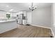 Open concept kitchen and dining area featuring stainless steel appliances, granite counters and modern flooring at 219 Proctor Dr, Salisbury, NC 28147