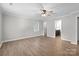 Spacious living room featuring wood-look flooring, neutral walls and a ceiling fan at 219 Proctor Dr, Salisbury, NC 28147