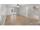Spacious living room featuring french doors, ceiling fan, and stylish flooring at 219 Proctor Dr, Salisbury, NC 28147