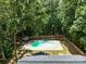 Aerial view of the home's fenced-in in-ground pool and patio area at 219 Proctor Dr, Salisbury, NC 28147