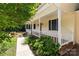 Charming front porch with white railings, complemented by manicured landscaping and a walkway leading to the entrance at 219 Proctor Dr, Salisbury, NC 28147